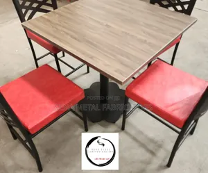 Brown Table and 4 Chairs With Powdercoating