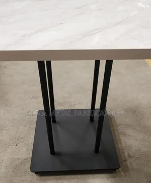 Cream Marble Look Table With Powdercoating Finish.