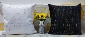 White and Black Decor Pillows With Gold Patcjes