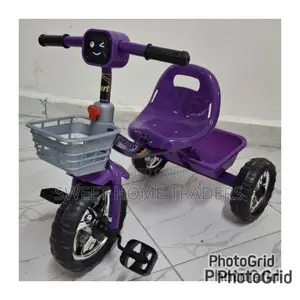 Kids Tricycles 
Has Lights and Melodies . Purple
