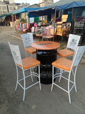 Unique Bar Set of White Coated Chairs and a Drum Table 