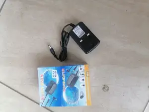 Compact 
Power Adapter Dc 12v 2a Adaptor