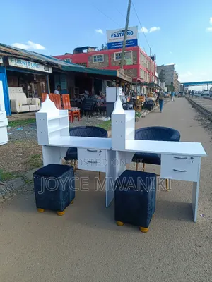 Manicure Set, White Board Table, and Black Seats