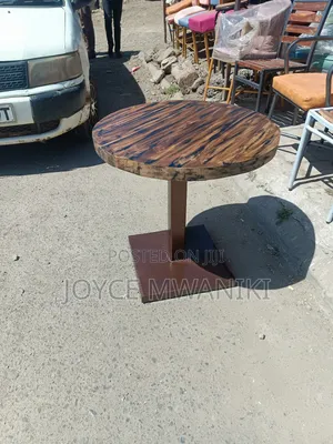 Round Restaurant Wooden Table With a Rustic Finish 