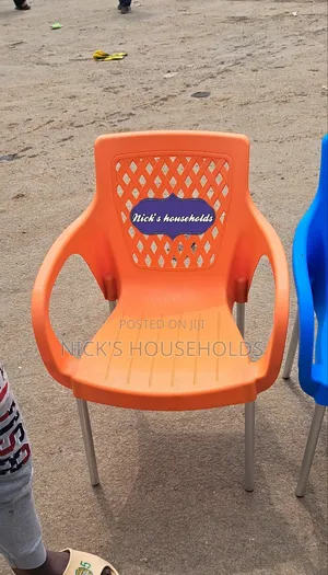 Orange Colour Plastic Chair With Metal Tubing Legs Arms