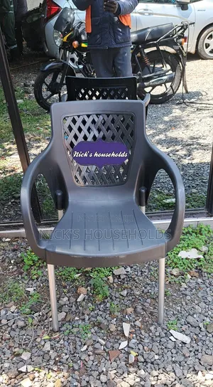 Quality Plastic Chair With Metal Tubing Legs and Armrest