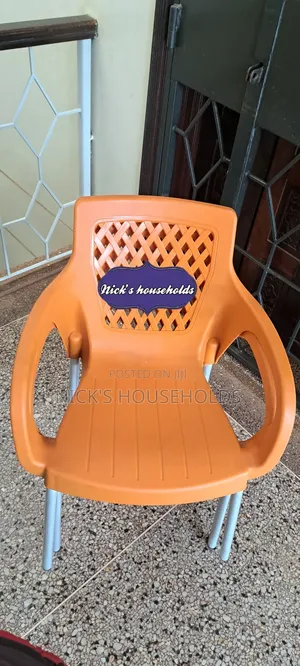 Orange Plastic Chair With Poly and Metal Legs