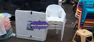 4 Plastic Chairs With Square White Plastic Table