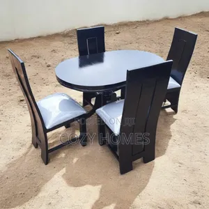 An Attractive Oval 4 Seater Dining Set, in Shiny Black
