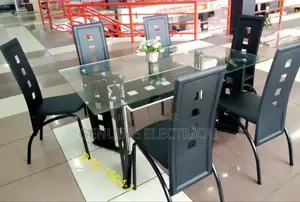 Glass Dinning Table 6 Set With Metallic Leather Seats