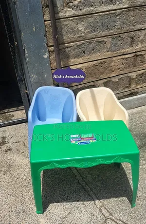 Green Table With Plastic Chairs
