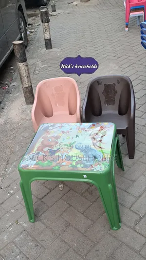 Child Plastic Chairs and a Table Set