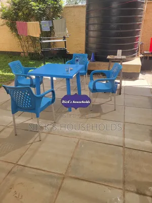 Plastic Table With Four Legs + 4 Plastic Chairs Set
