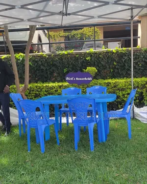 1 Plastic Table With 6 Plastic Chairs