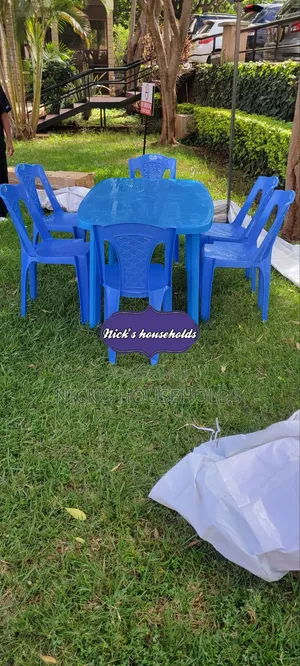 Rectangular Plastic Table With Six Plastic Armless Chairs