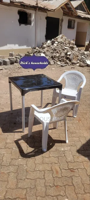 Black Plastic Table With White Plastic Chairs Set
