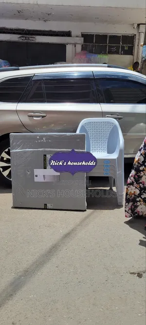 4 Skyplast Plastic Chairs With a Plastic Table