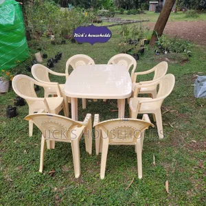 Cream Plastic Chairs With a Rectangular Plastic Table Set