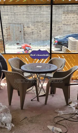 Plastic Chairs + Round Plastic Table With Foldable Metal