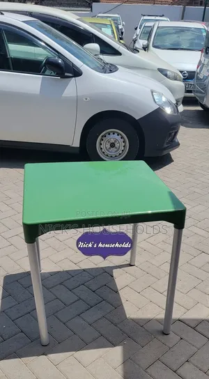 Green Plastic Table With Metal Tubing Legs
