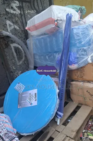 Garden Umbrella With a Round Plastic Table Set