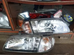 B15 Nissan Japan Front Lights; Complete With Bulbs