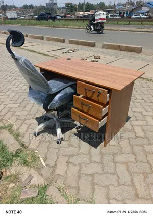 Well Furnished Brown Office Desk and Headrest Office Chair