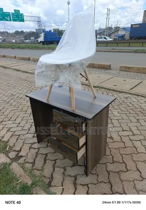 Available Office Desk and White Eames Chair