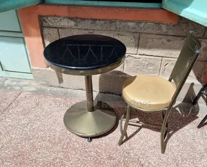 Restaurant Table With Black Marble Top.