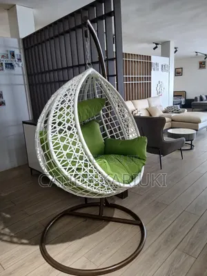 White Swing With Green Cushions