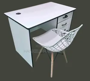 White Black Table and Perforated Chair