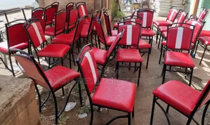 Restaurant Maroon Chairs With White Backrest Fabric.