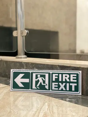 Fire Exit Sign – Left Exit Instruction Plate .