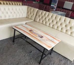 Set of 2 Couches With a Table for a Bar.