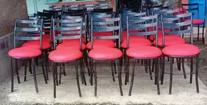 Restaurant Dining Chairs With Red Seating Cushions.