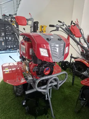 Diesel Power Tiller With Attachments.