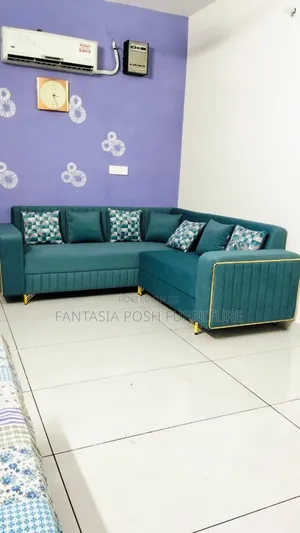 Elegant Teal L-Shaped Sofa With Gold Accents