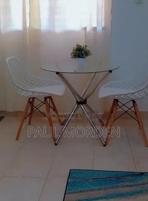 Round Table +Two Eames Dining Chair