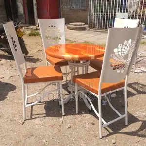 Restaurant And Bar White Chairs And Round Marble Table