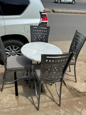 Restaurant And Bar Silver Coated Chairs And Marble Table