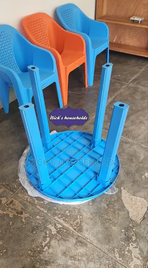 Plastic Chair (Easy Chairs) and a Round Plastic Table
