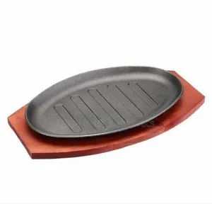 Cast Iron Hot Sizzling Plate on Wooden Tray