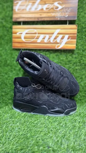 Jordan 4 Kaws "Black"