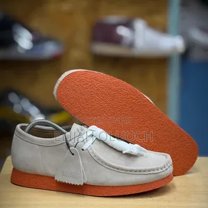 Clarks Wallabees
Grey/Orange Leather Shoes