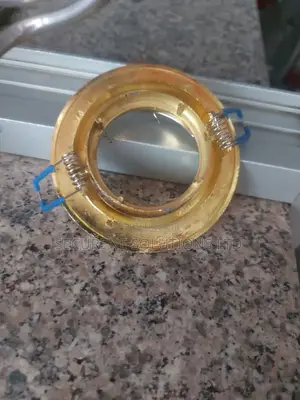 Round, Golden-Colored Recessed Spotlight Frame