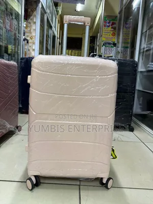 Peach Medium Size Rubber Suitcase a 1pc Medium With Double Zip