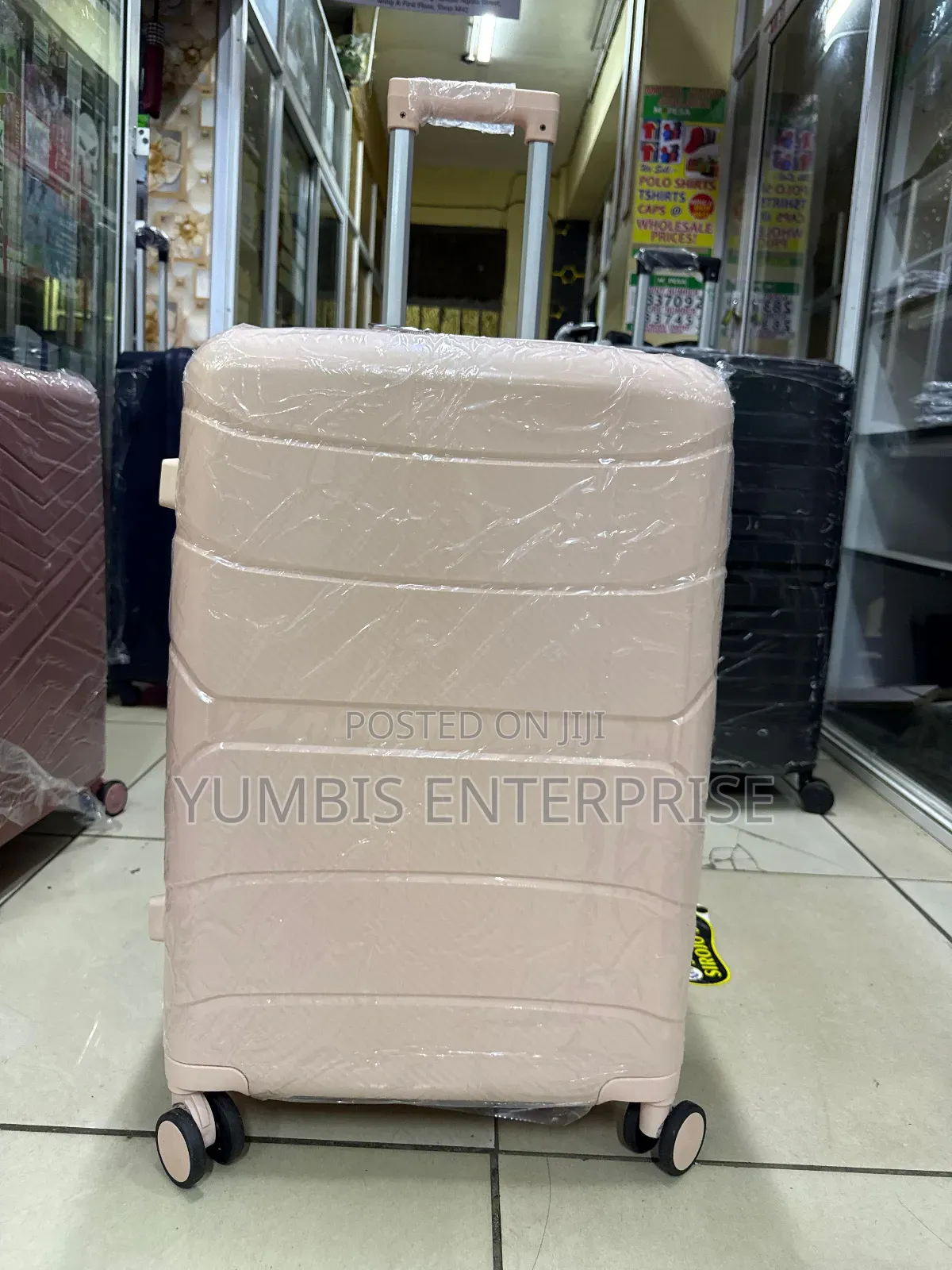 Peach Medium Size Rubber Suitcase a 1pc Medium With Double Zip
