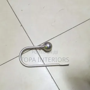 Metallic Wall Curtain Holders to Act as Curtain Tiebacks