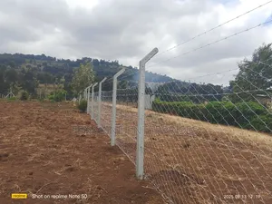Concrete Posts + Chain Link Fencing