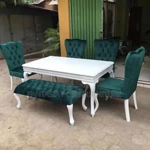 White Dining Table With Green Velvet Tufted Chairs and Bench